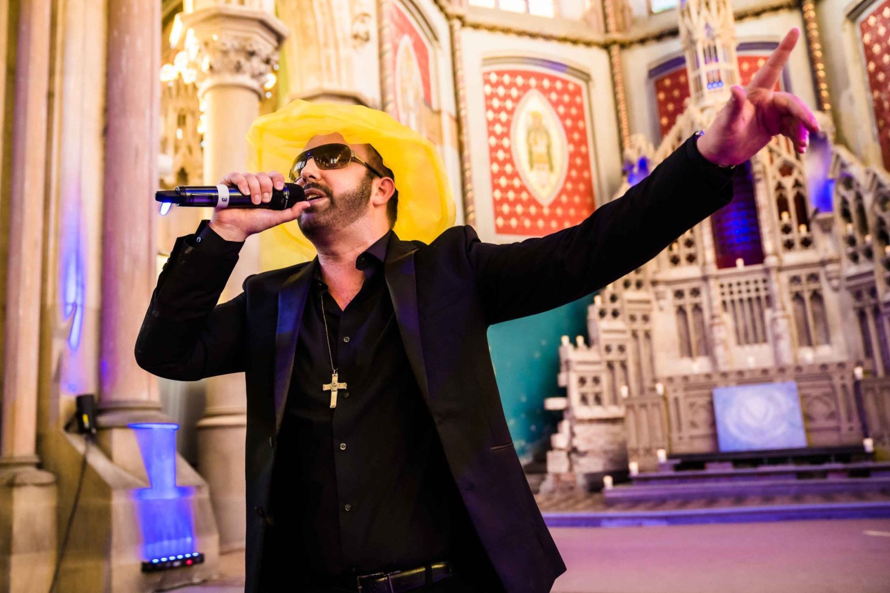 George Michael impersonator performing at a wedding