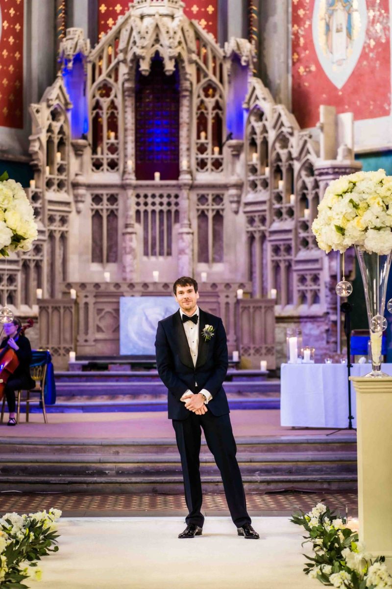 Groom waiting at altar at Manchester Monastery
