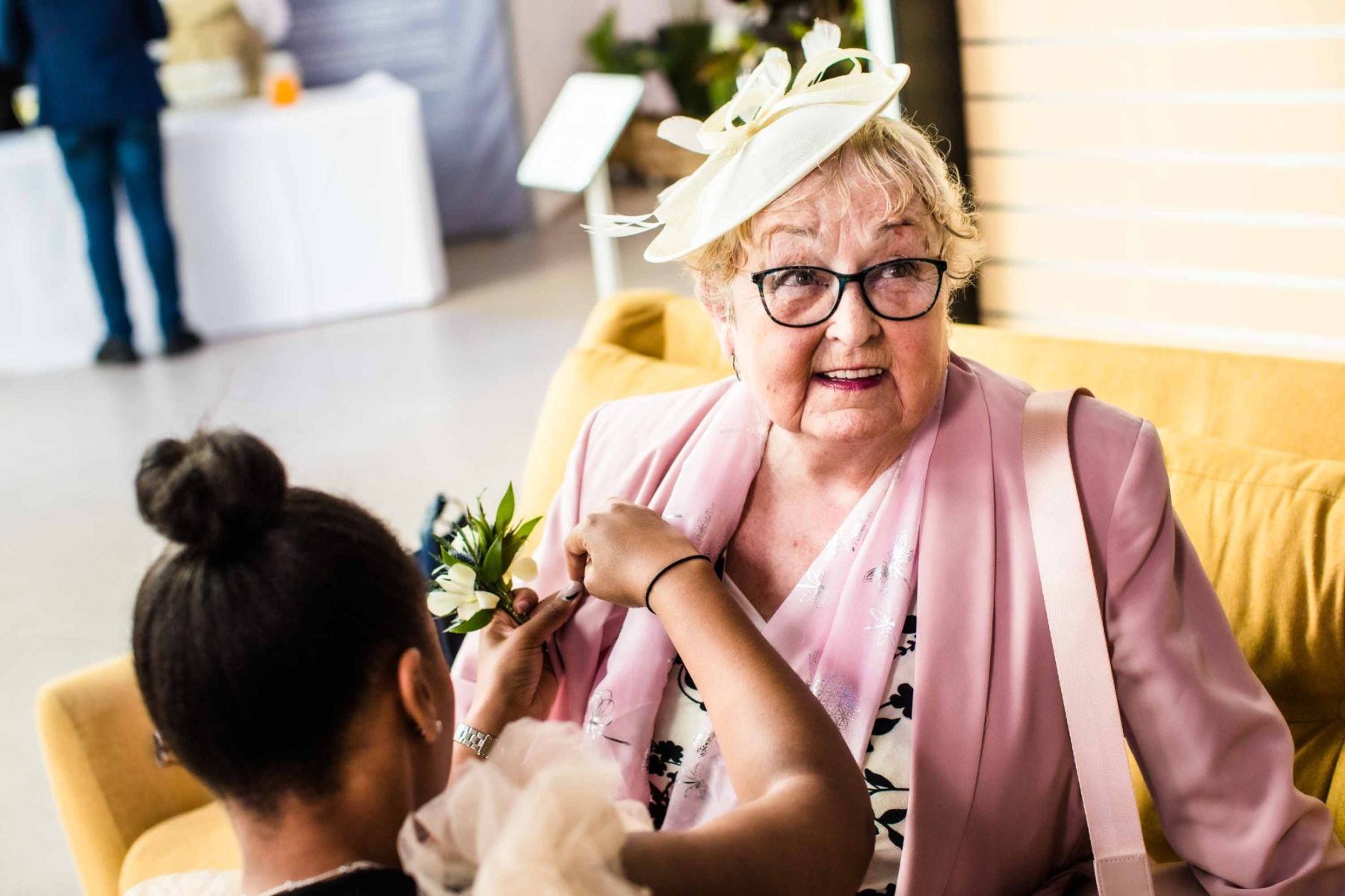 Nan having her buttonhole pinned on